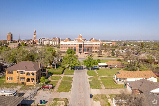 OKC University School of Business office sit near cozy homes of the Epworth residents.