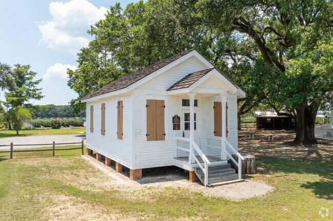 The old schoolhouse at Heritage Park hosts visitors with staff who dress in period clothing.