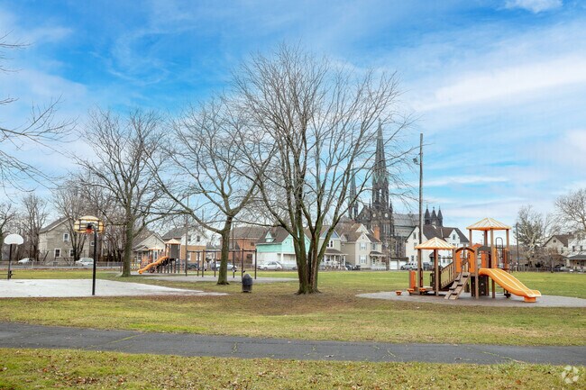Luis Muñoz Marin Dual Language Academy housed a colorful playground with a slide and swing set.