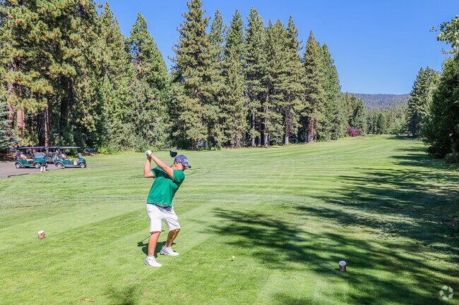 A golfer takes his first swing at Old Brockway Golf Course.