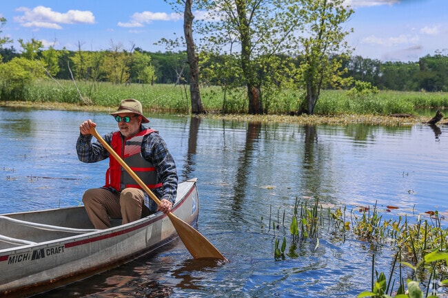 Embark on a peaceful canoe adventure at Mass Audubon's Ipswich River Wildlife Sanctuary near Hamilton, where winding waterways lead through lush wetlands teeming with wildlife.