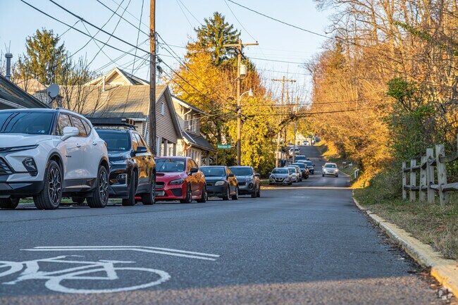 The Woodburn streets are made narrow for travelers with all the cars parked on the street.
