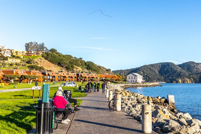 Residents are seen strolling with their friends at Shoreline Park.