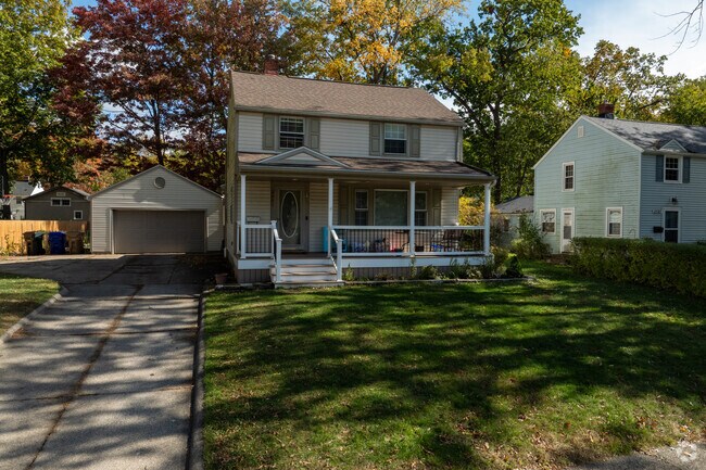 A beautiful Colonial Revival home with a covered porch, located in the River Estates neighborhood.