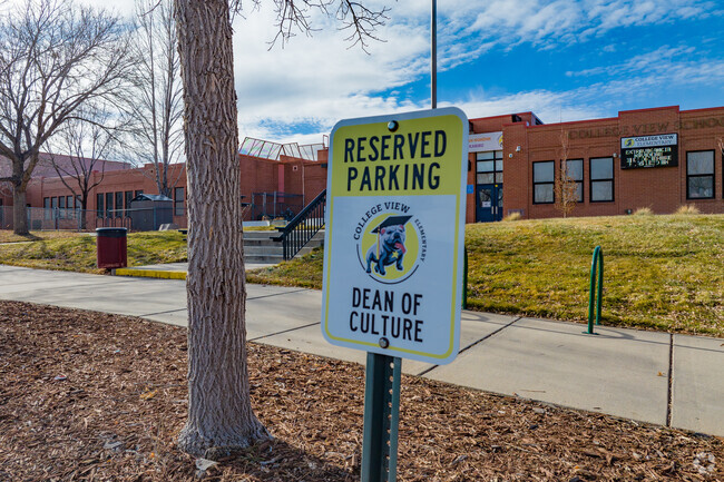 Reserved parking at College View Elementary School on a warm winter day in Denver, Colorado.