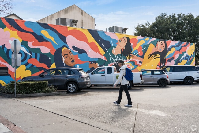 Colorful mural backdrop to a casual sidewalk stroll near Clearfield Park.