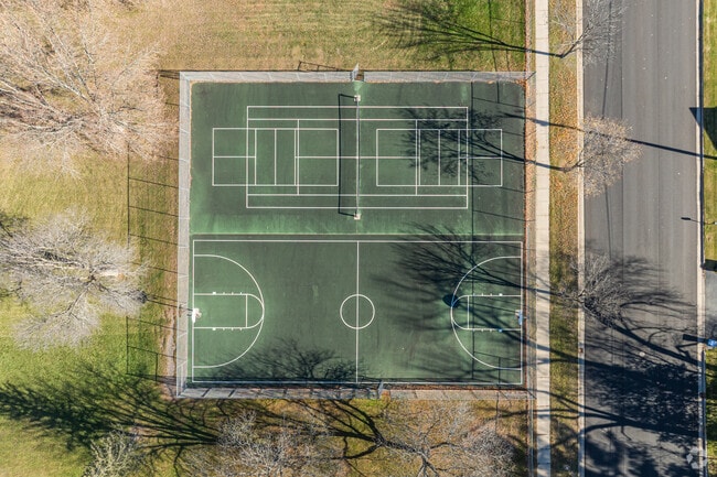 Families enjoy the playground, tennis court, and basketball court at Ripple Creek Park.