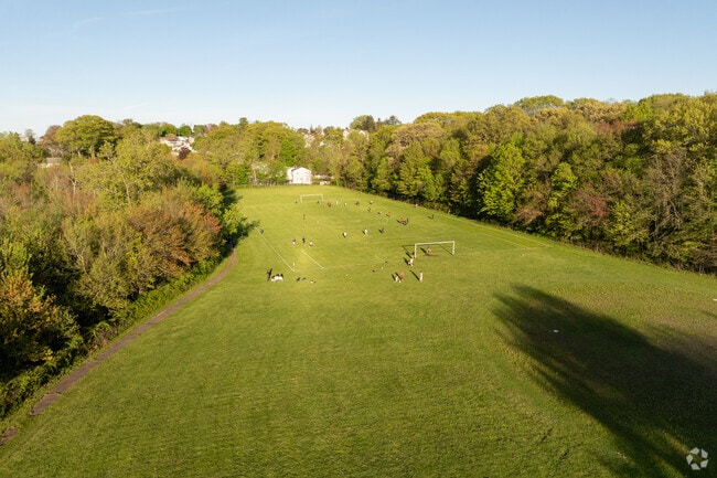 John F. Kennedy High School has a large field for sports.