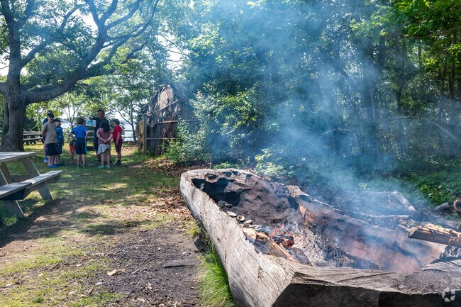Members of the Wampanoag Tribe teach Mashpee students about their rich history at the Waquoit Bay National Estuarine Research Reserve.