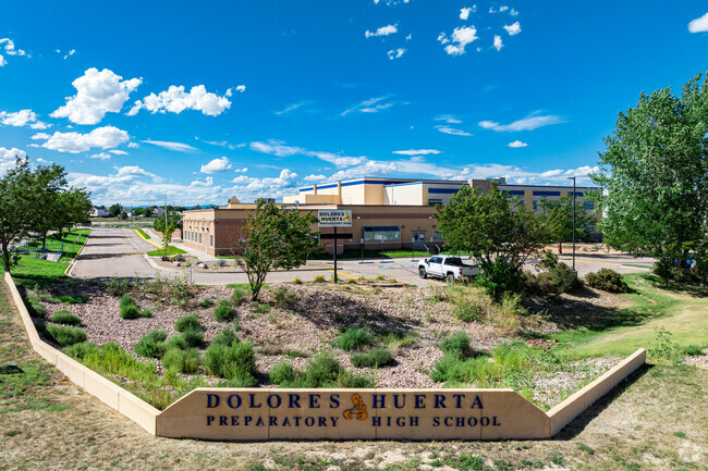Chavez/Huerta K-12 Preparatory Academy welcomes students with a large sign.