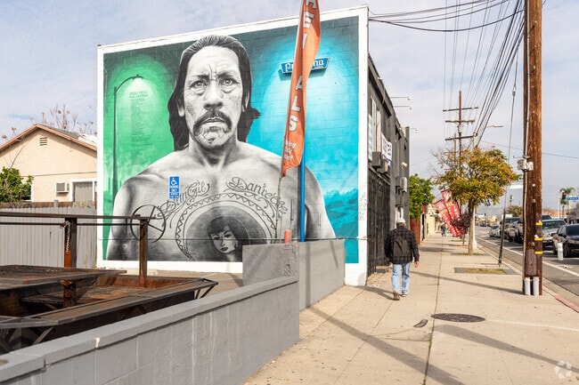 A man walks past the Danny Trejo mural on Mural Mile in Pacoima.