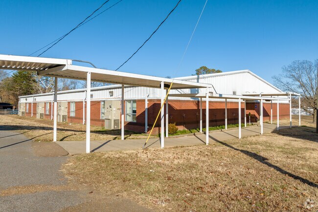 The covered walkways at Strayhorn High in Tate County helps keep students dry on rainy days.