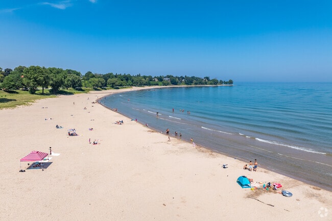 Deland Park in Central Sheboygan offers shade, sand, and lake views on hot summer days.