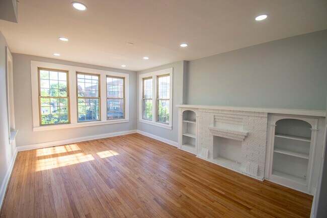 Sunny front room overlooking trees and a nice neighborhood
