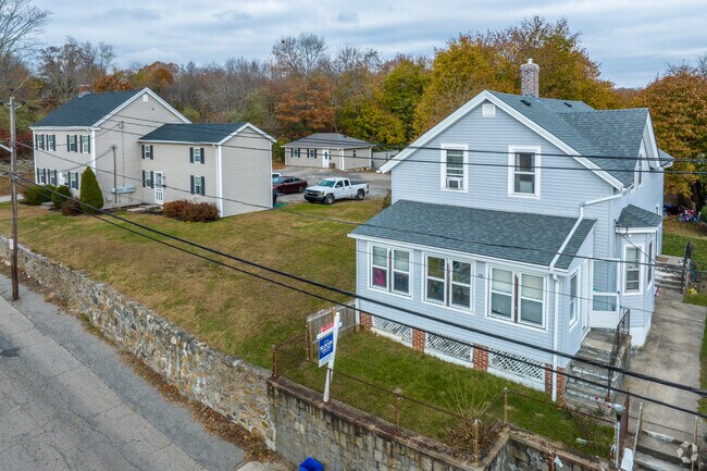 Colonial-style homes sit on the hills of Lippitt-Harris, offering views of the town.