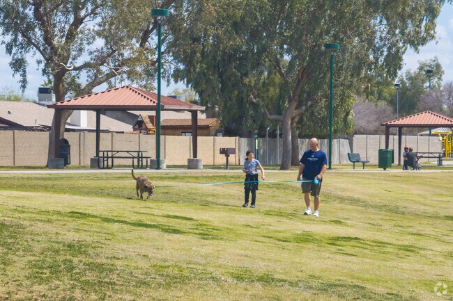 Sherwood Park in Mesa includes a playground and a large field for various outdoor activities.