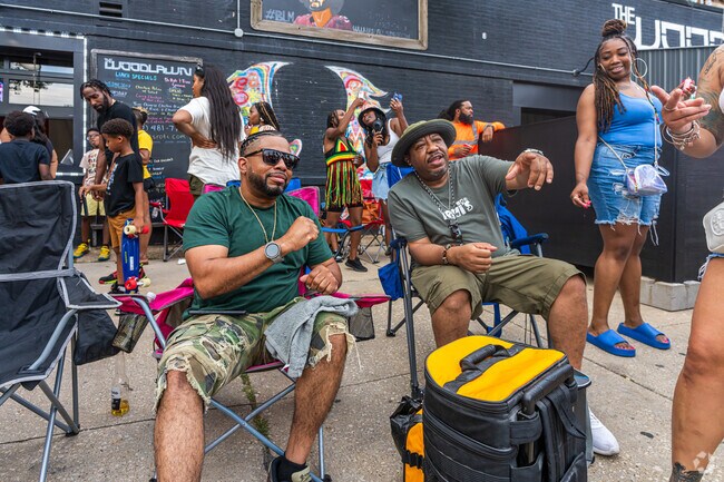Locals chat at the Juneteenth Block Party in Grand Crossing.