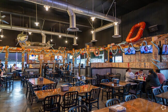 Enjoy Cajun-style crab dishes near Ashbridge at The Boiling Crab.