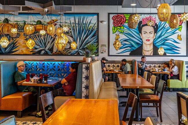 Añejo Cocina Mexicana restaurant includes a full-service bar and ample seating, providing a comfortable setting for patrons to enjoy authentic Mexican cuisine.