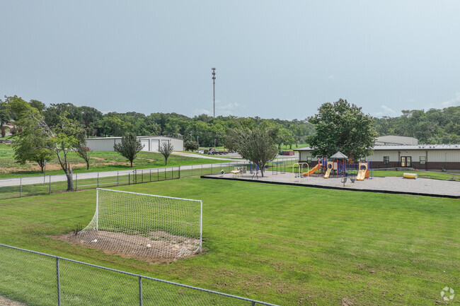 Students at Justus-Tiawah Public School have acres of green space to run and play.