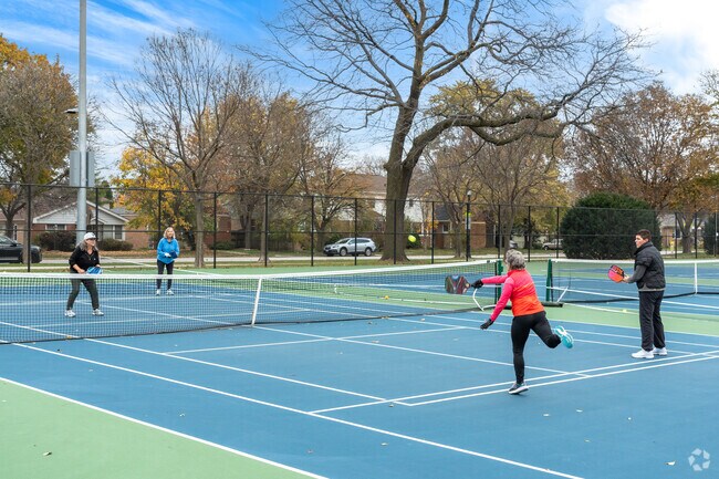 James Park has both tennis and pickleball markings on the outdoor courts.