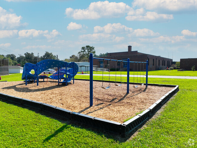 Washington-Henry Elementary School has a small jungle gym and swing set.