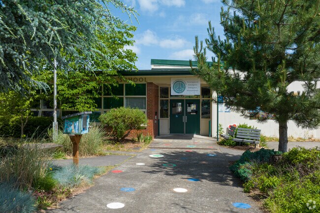 Students see a free little library when entering Lewis Elementary on Evergreen St in Portland.