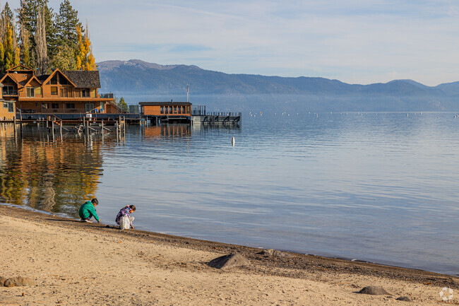 Two children play in the clear shores of the Tahoe Vista Coast.