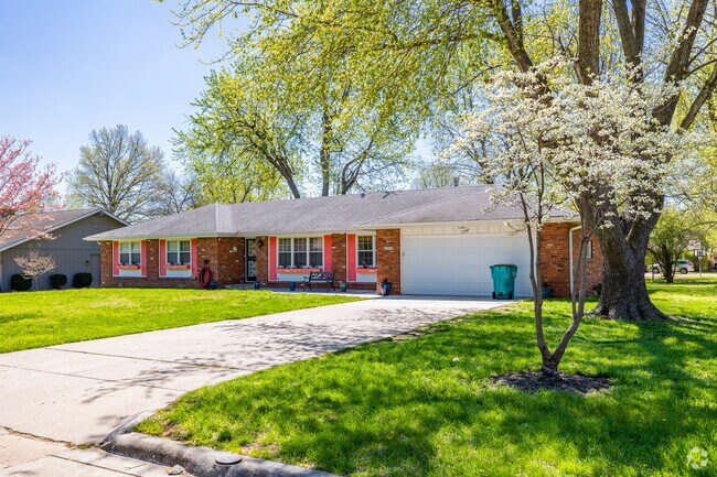 A ranch home with brightly painted shutters draw attention in Bradford Park.