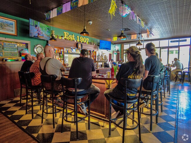 Sit around the bar and enjoy a drink with friends at Gold Bar.