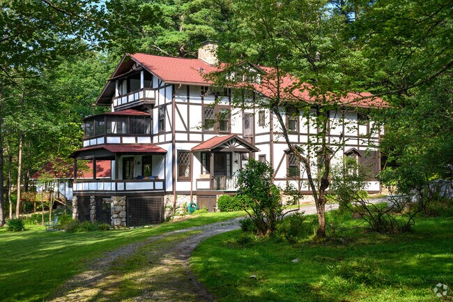This Cragsmoor estate features Tudor-style influences with its stucco exterior.