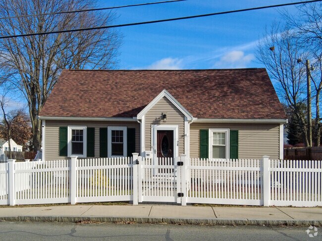 Single family home with fenced in front yard in Mine Falls Park.