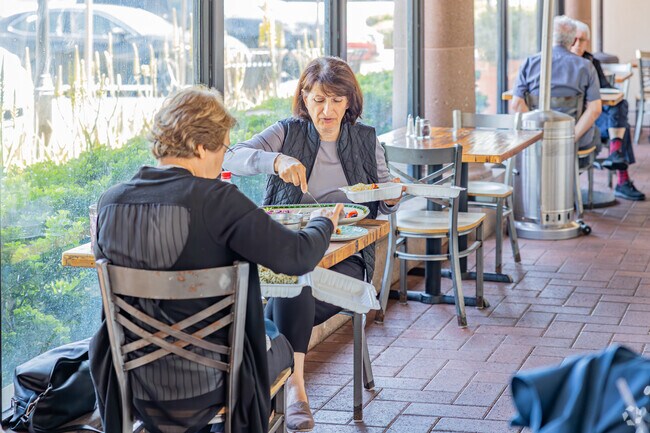 Sit down at the enclosed patio for a tasty meal at Irvine Grill.