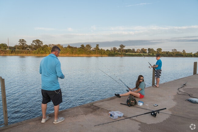 Early morning and late evening draw fishers to the Red River in the neighborhood.