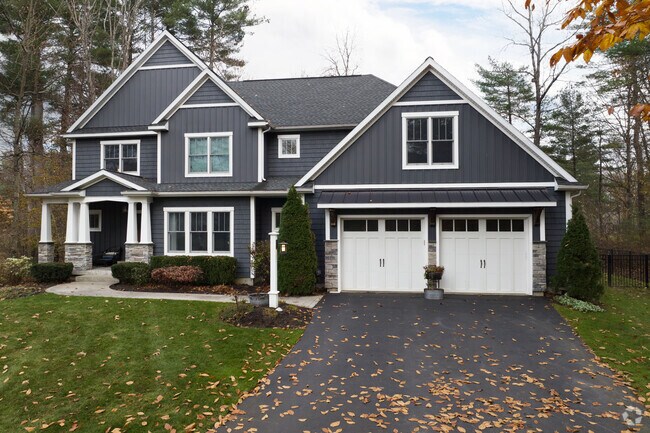 A new colonial with a large garage in Wilton.