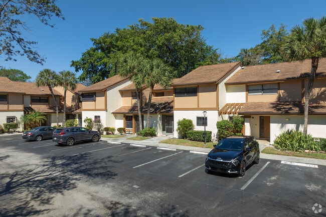 Embrace townhouse living in the vibrant Coral Gate community.