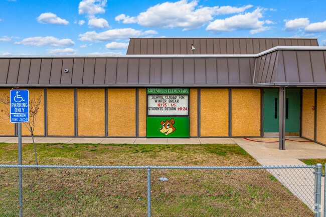 Important information can be found on the entrance sign of Greenhills Elementary School.