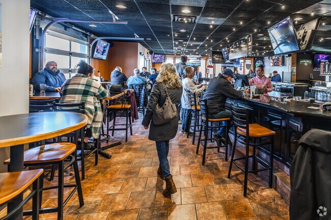 The Thirsty Duck is a popular gathering place offering drinks, pub food, and duckpin bowling near Lisbon.