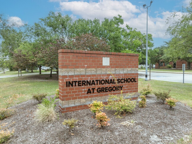 Brick signage at the entrance to the International School at Gregory.