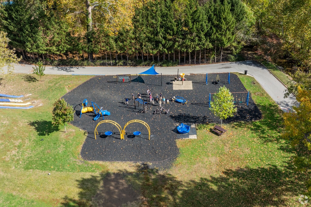 Students at Wheeling Country Day School play outside on a large playground.