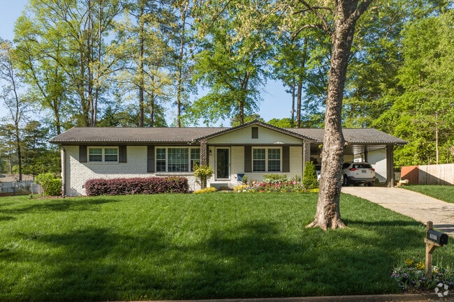Ranch style homes in Powers Park reside on well kept lots surrounded by tall shade trees.