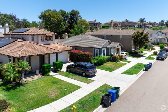 Neighborhood homes sit along the area's rolling hills.