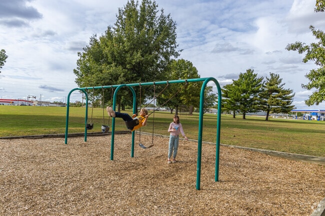 Soar on the swings at Knights of Columbus Park in Camelot.