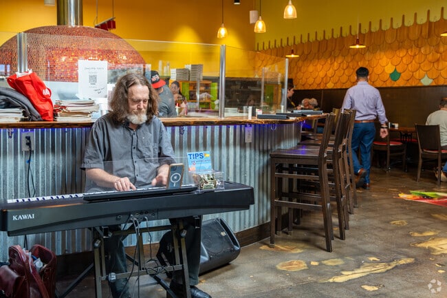 Some restaurants near Indian Hills, like Noosh Nosh, offer live entertainment during meals.