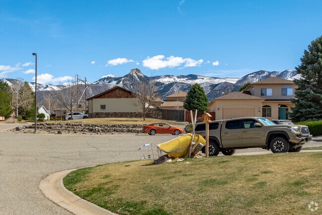 Battlement Mesa, Colorado, is lined with charming middle-class homes framed by the rugged peaks of the Western Slope. Each street captures a slice of mountain life, where comfort meets breathtaking views right outside your front door.
