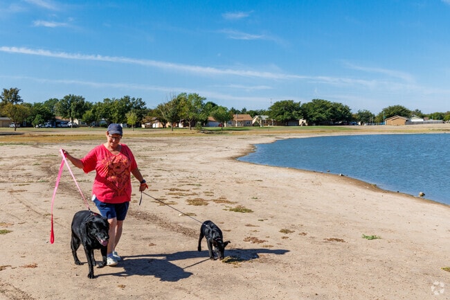 Earl Crow Park in University Pines offers a peaceful lakeside stroll for dog walkers.