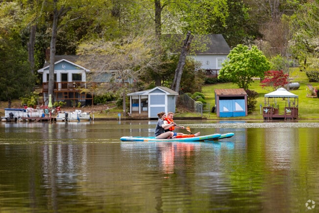 Out on the calm waters of High Falls Lake in Towaliga Shores, these two are paddleboarding side by side, soaking up the laid-back lake life.
