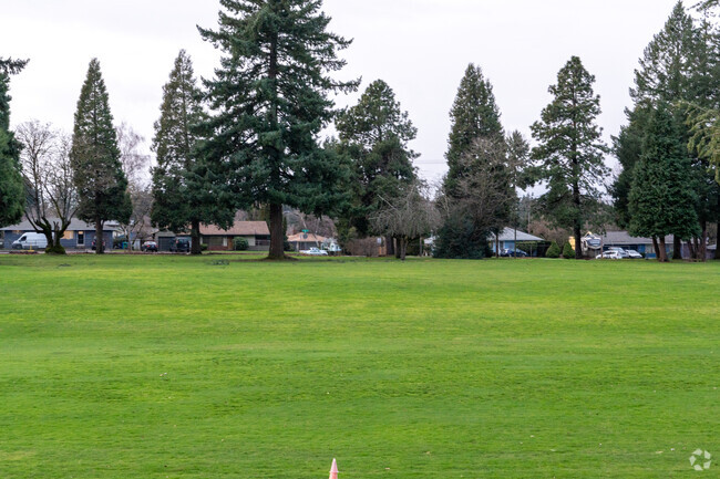 A large sports field sits to the west of campus.