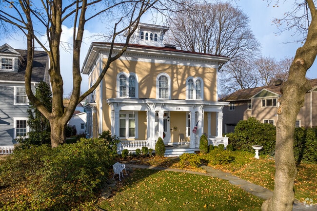 An exceptional American Foursquare-style home with a covered front porch in West Pittston, PA.