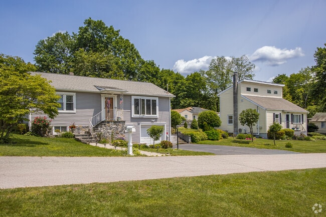 Homes in Lake Carmel line up near the water with porches, quiet roads, and the kind of spacing that gives you both privacy and neighbors.